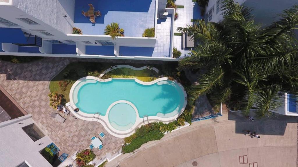 an overhead view of a swimming pool in a resort at Retreat Haven in La Bella Tagaytay in Tagaytay