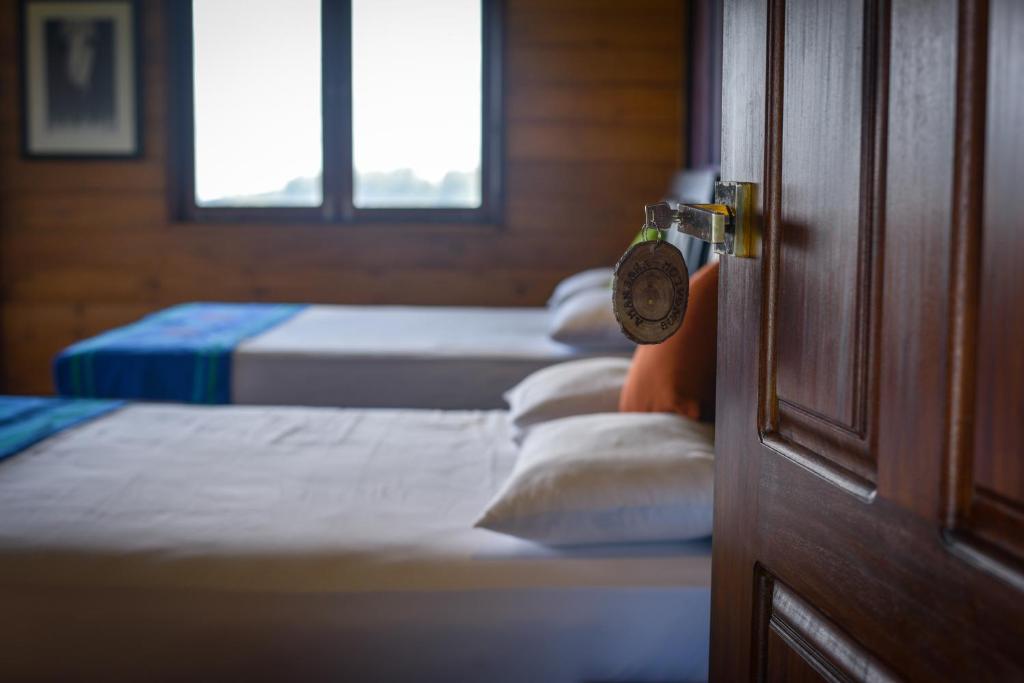 Postel nebo postele na pokoji v ubytování Amansara Bungalow