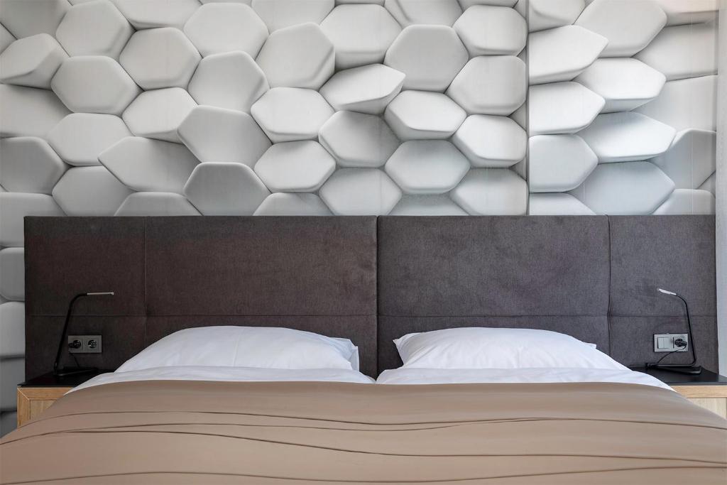 Postel nebo postele na pokoji v ubytování 4 SMART HOTEL