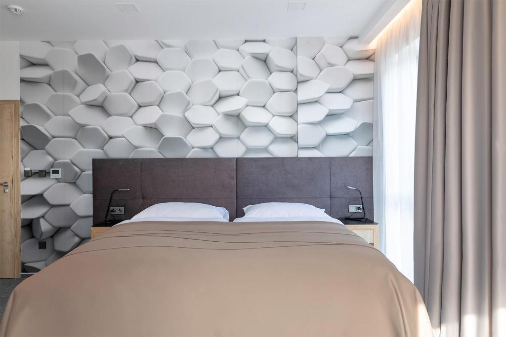 Postel nebo postele na pokoji v ubytování 4 SMART HOTEL