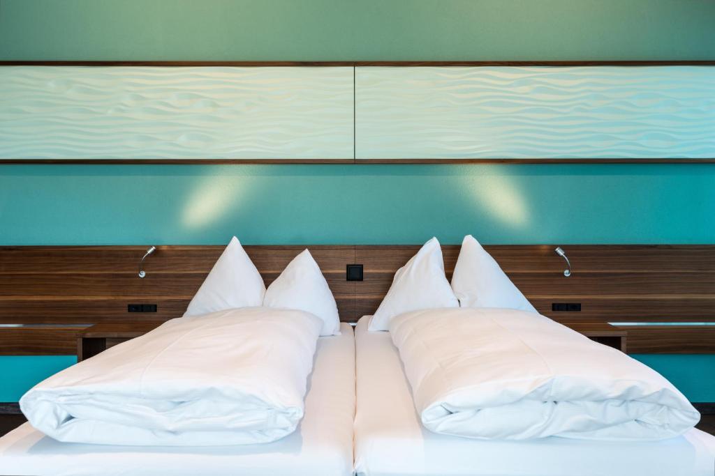 Postel nebo postele na pokoji v ubytování Superior Hotel Nidwaldnerhof