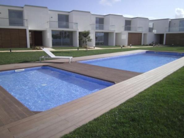 a large swimming pool in front of a building at Sea Sagres in Sagres