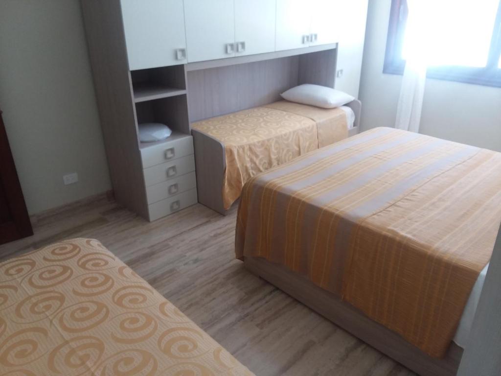 Postel nebo postele na pokoji v ubytování Oasi Encantada - Beach Resort