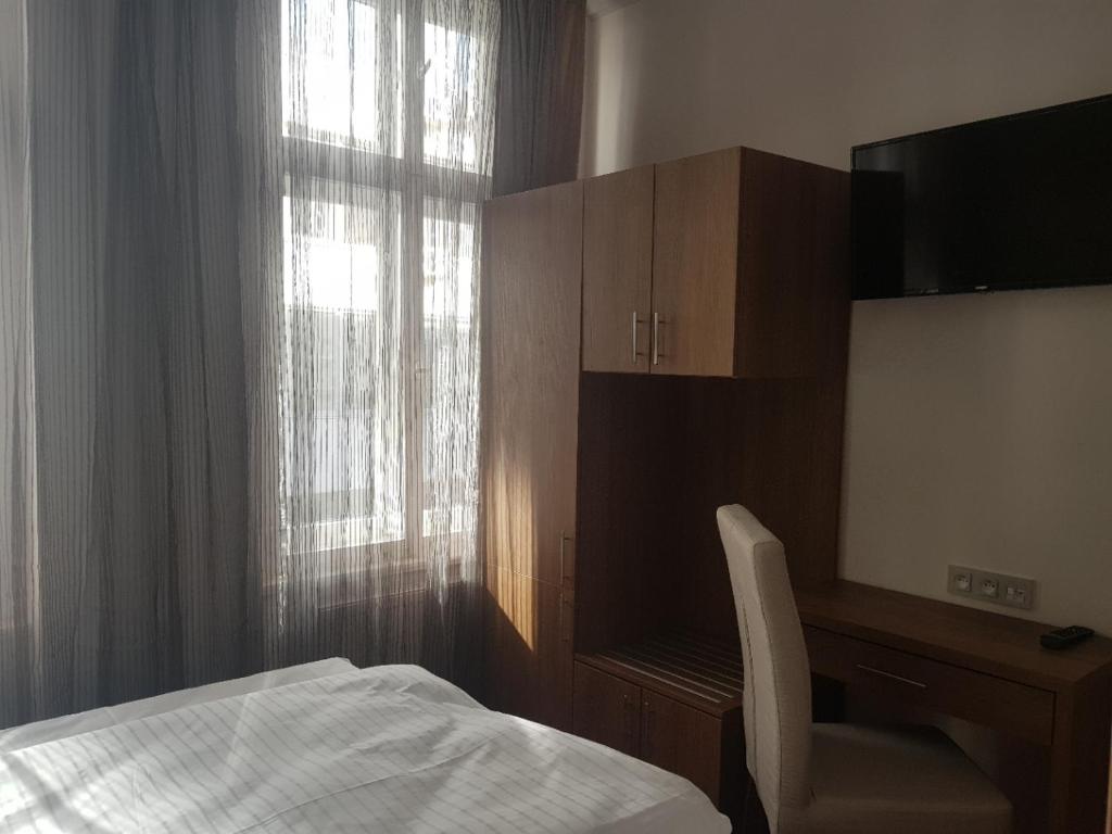 Postel nebo postele na pokoji v ubytování Hotel Prague Star