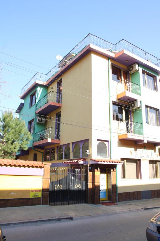 a building on the side of a street at Hotel Color in Asenovgrad
