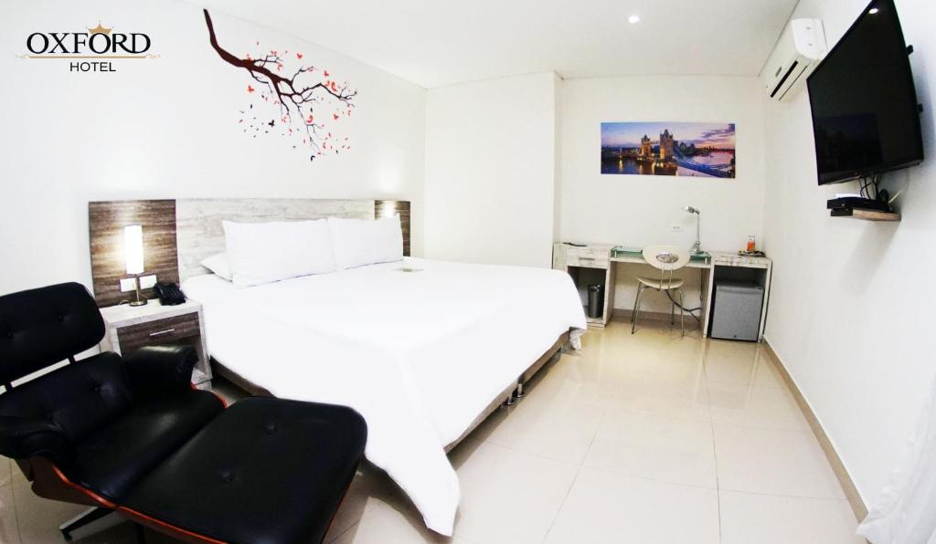 Postel nebo postele na pokoji v ubytování Hotel Oxford Barranquilla