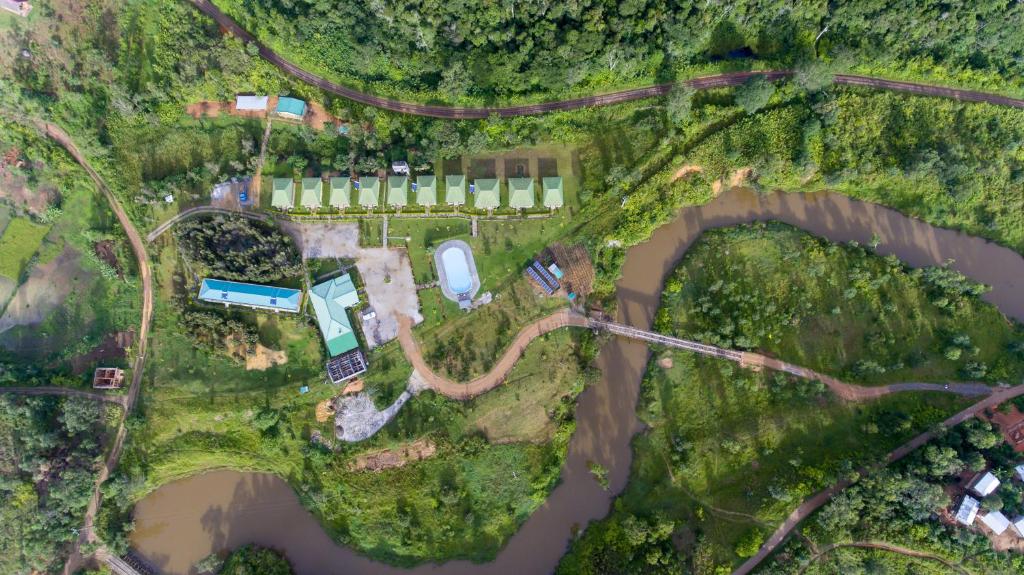 a map of a park with a river and a road at Andasibe Lemurs Lodge in Andasibe