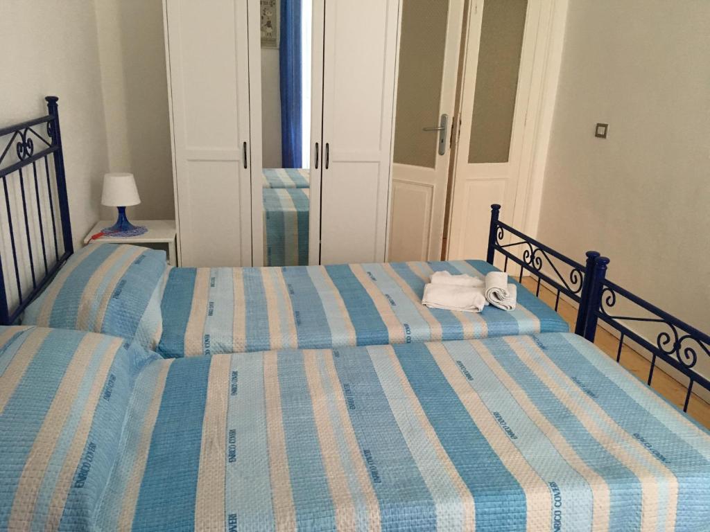 Postel nebo postele na pokoji v ubytování B&B Domus Gaetani