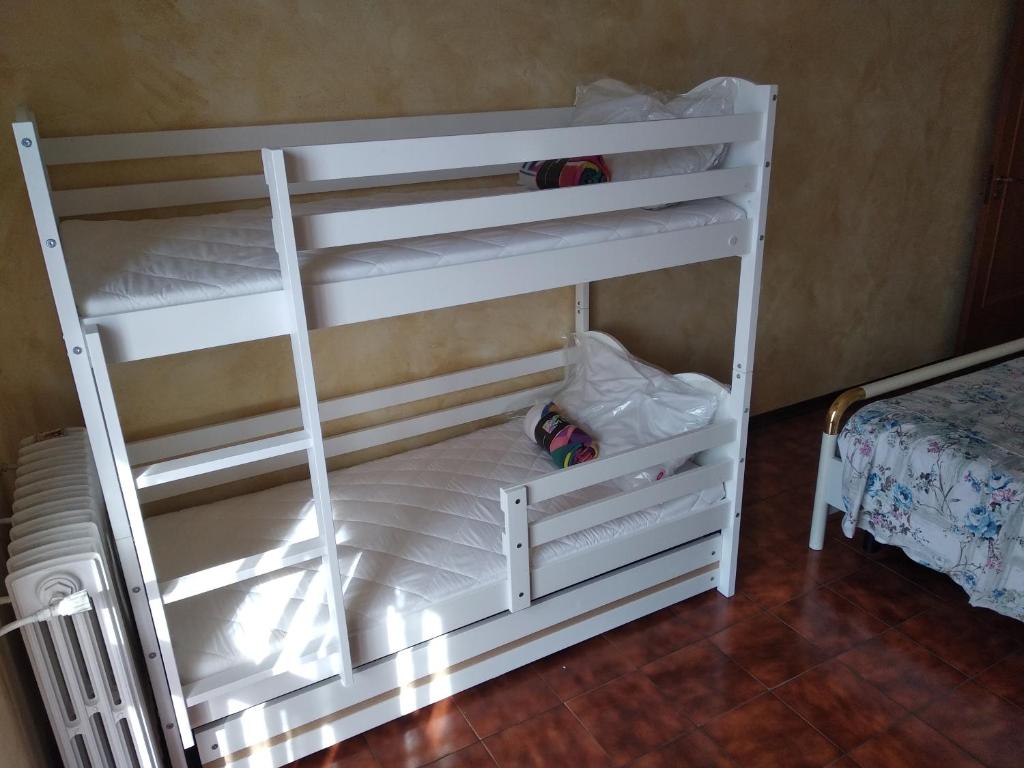 Łóżko lub łóżka w pokoju w obiekcie Appartamento da Marco