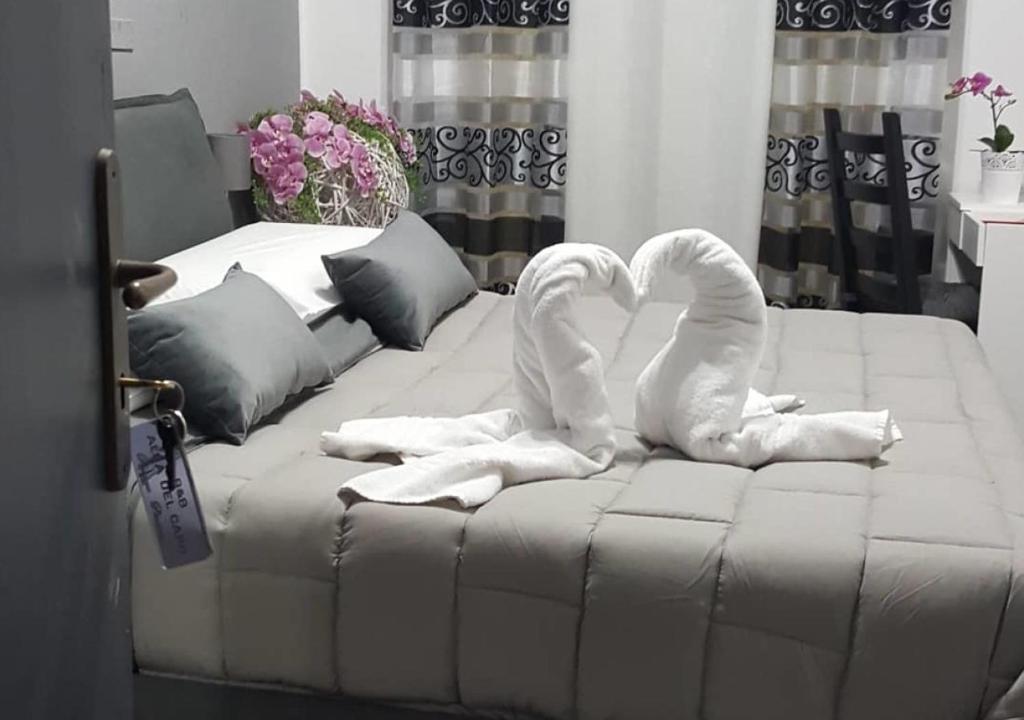 Una cama o camas en una habitación de ALBA DEL CAPO