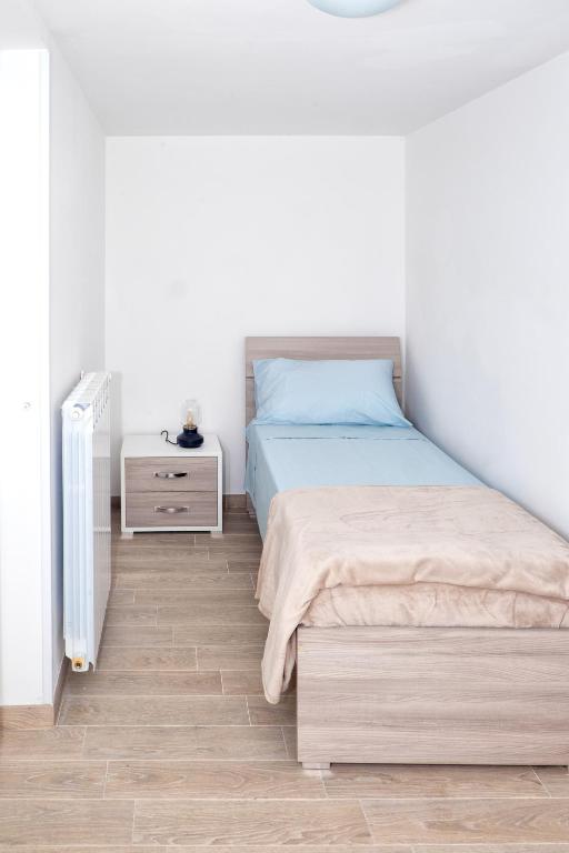 Łóżko lub łóżka w pokoju w obiekcie casa paola