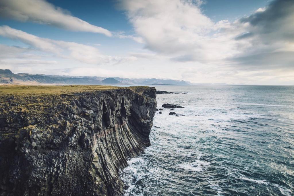 an image of the edge of a cliff near the ocean at Experience Beautiful Iceland in Ólafsvík