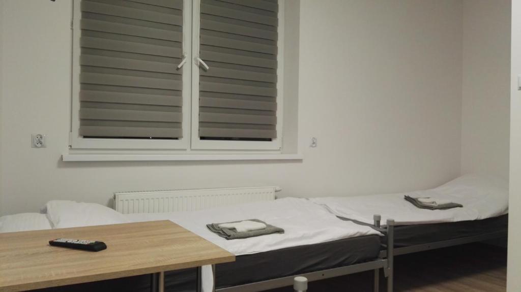 Postel nebo postele na pokoji v ubytování Wielobranżówka