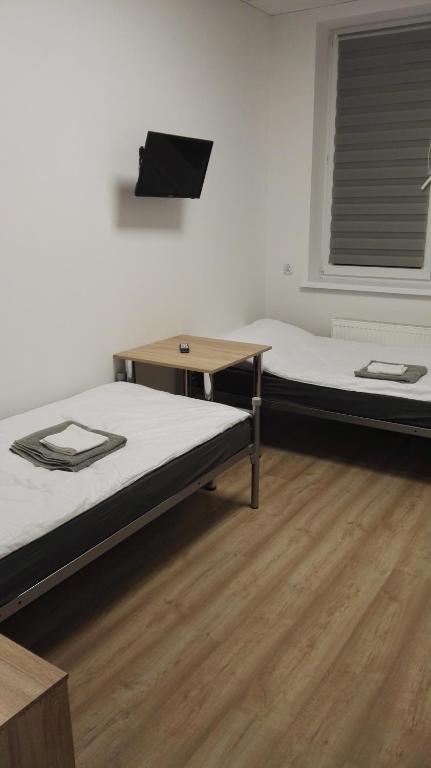 Postel nebo postele na pokoji v ubytování Wielobranżówka