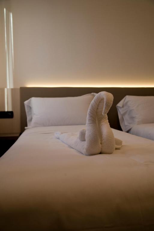 Postel nebo postele na pokoji v ubytování Albergo RISTORANTE SOTTOCASTELLO
