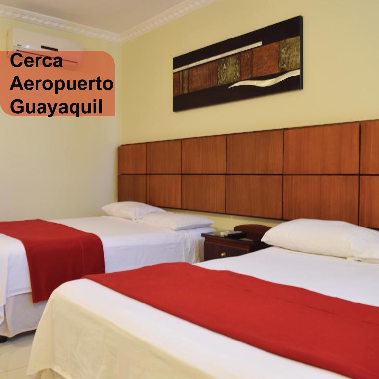 Postel nebo postele na pokoji v ubytování Hotel Murali - Cerca del Aeropuerto de Guayaquil