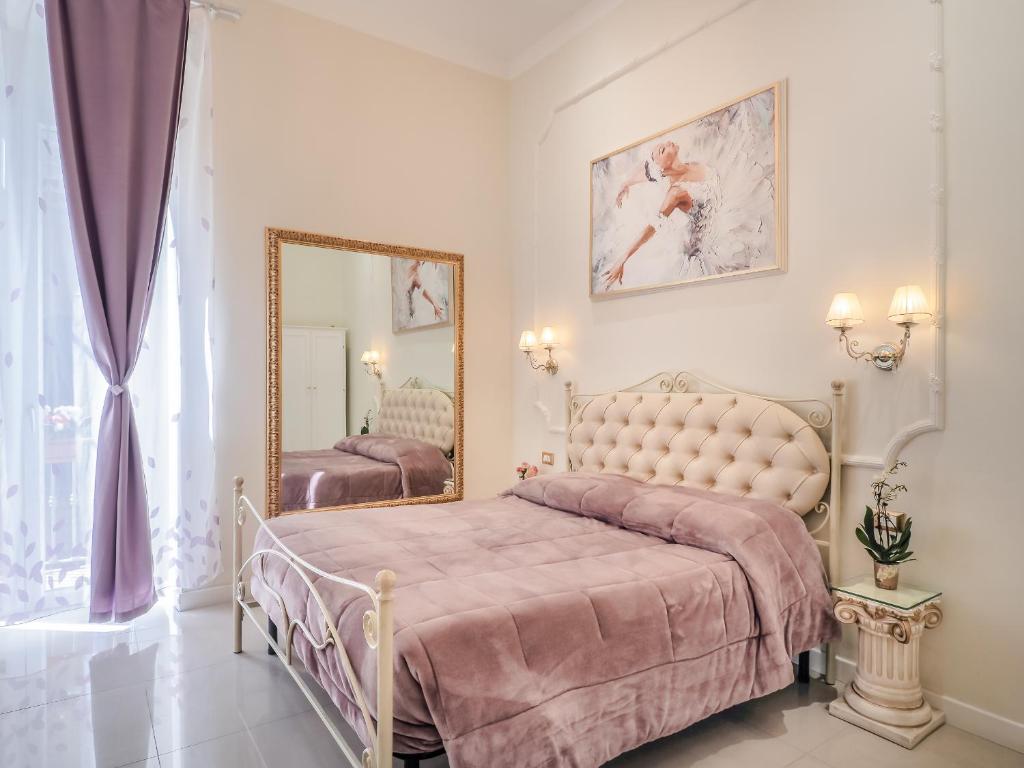 Postel nebo postele na pokoji v ubytování L'Opera Rooms & Suite