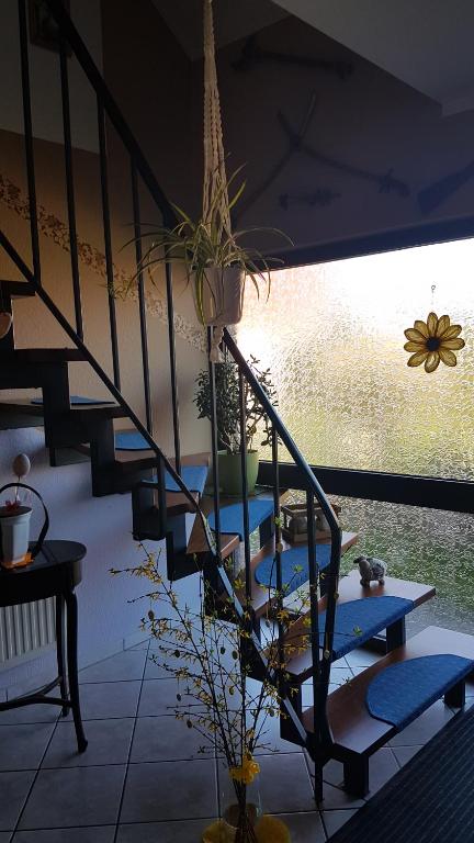 a staircase with a potted plant on top of it at Ferienwohnung Fiehn in Schwedt