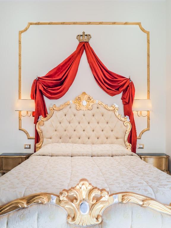Postel nebo postele na pokoji v ubytování L'Opera Rooms & Suite