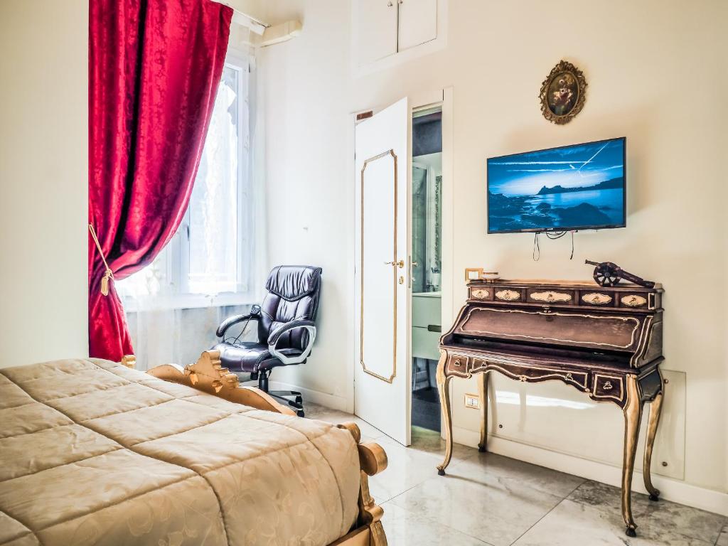 TV a/nebo společenská místnost v ubytování L'Opera Rooms & Suite