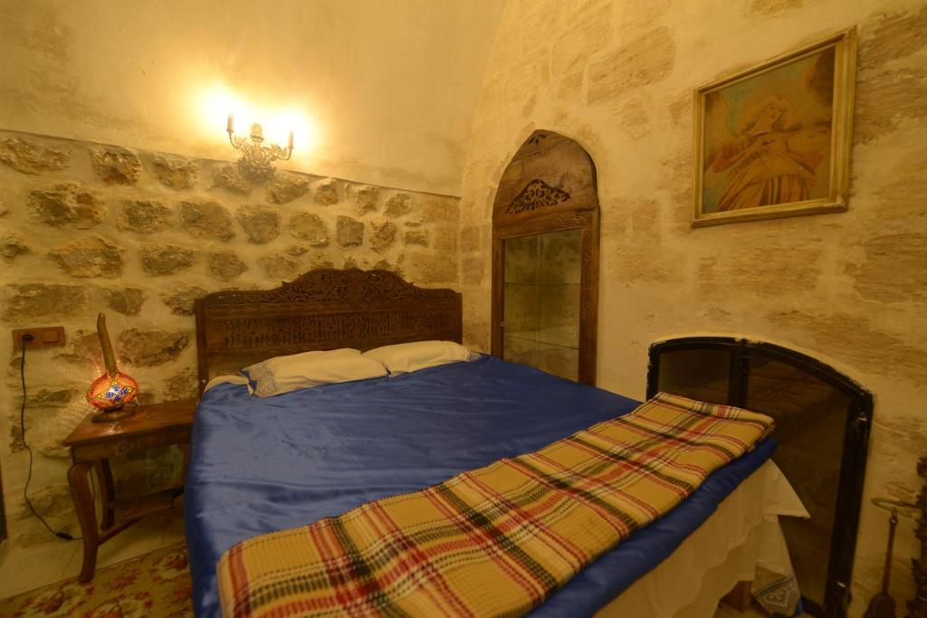 Postel nebo postele na pokoji v ubytování MERDİN BOUTİQUE HOTEL