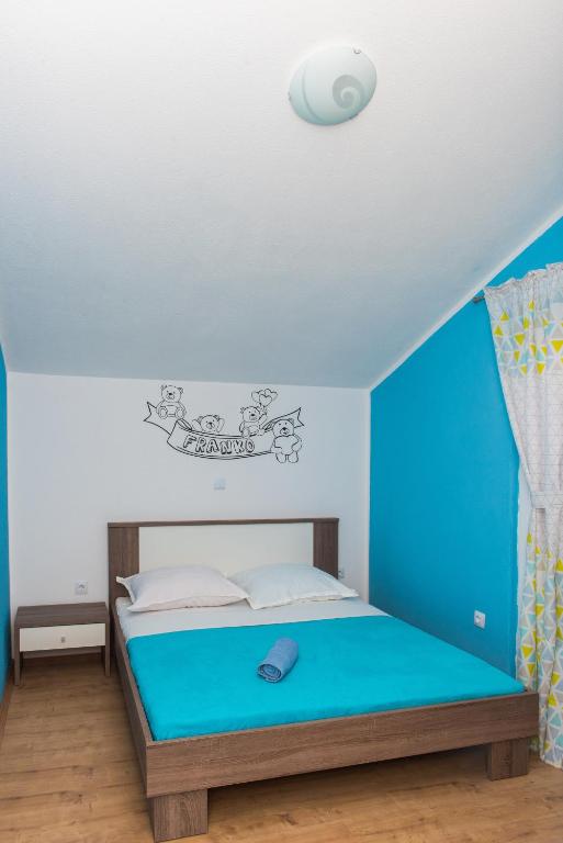 Postel nebo postele na pokoji v ubytování Apartman Franko