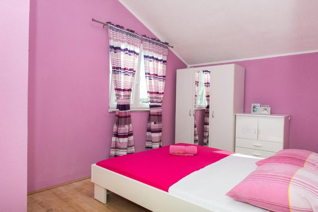 Postel nebo postele na pokoji v ubytování Apartman Franko