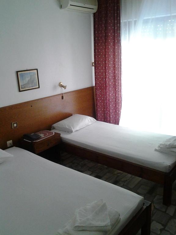 Postel nebo postele na pokoji v ubytování Orpheus Hotel