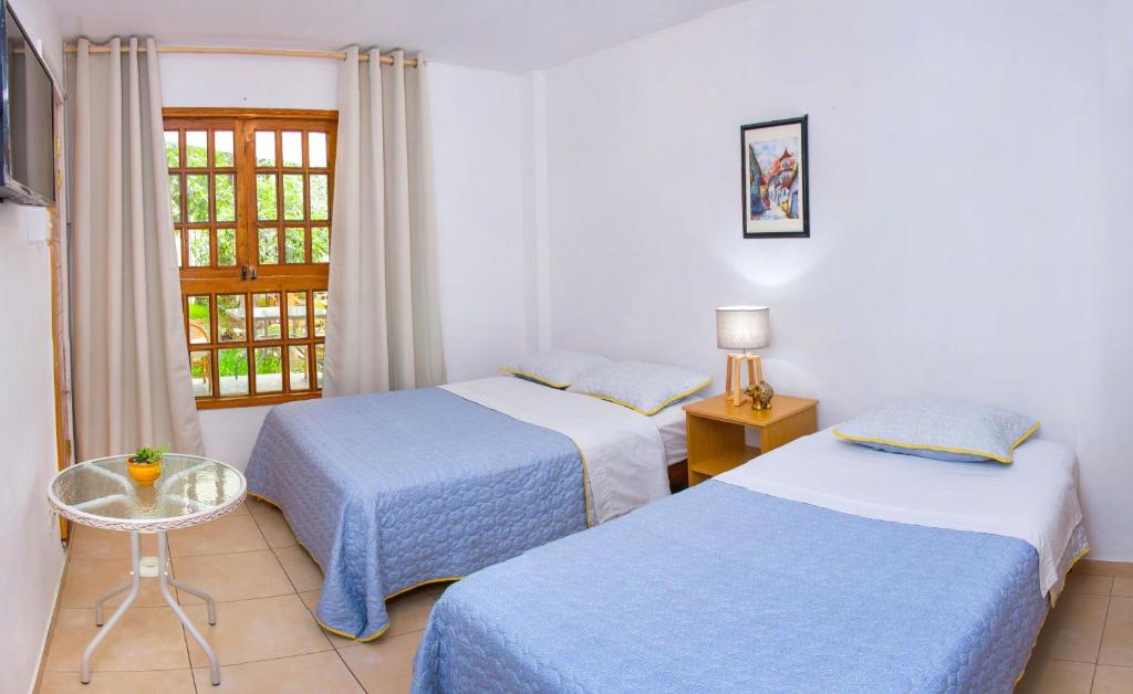 Postel nebo postele na pokoji v ubytování El Huerto Hostel