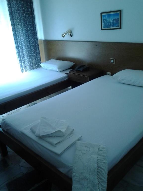 Postel nebo postele na pokoji v ubytování Orpheus Hotel