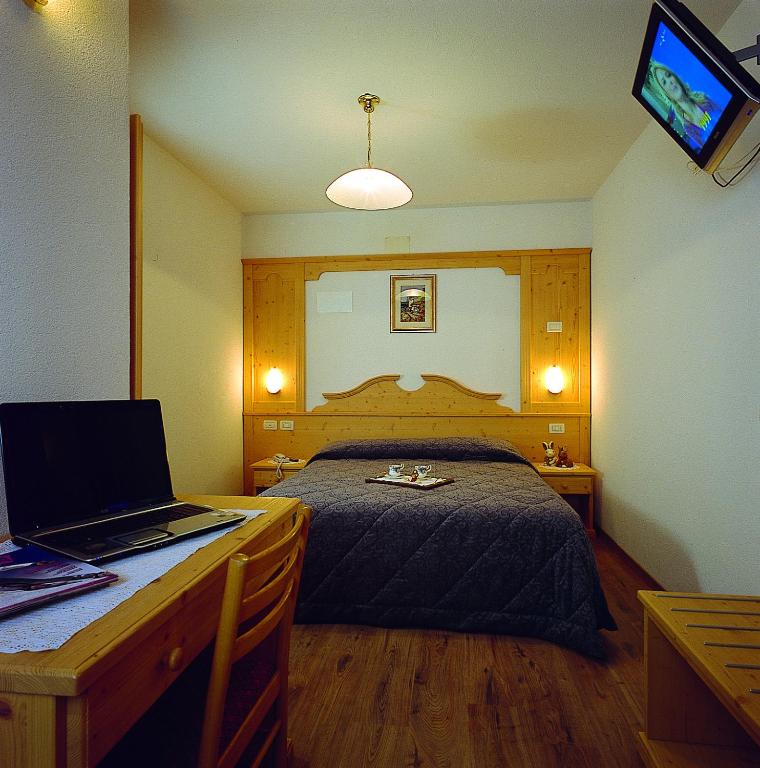 Postel nebo postele na pokoji v ubytování Hotel Al Plan Andalo