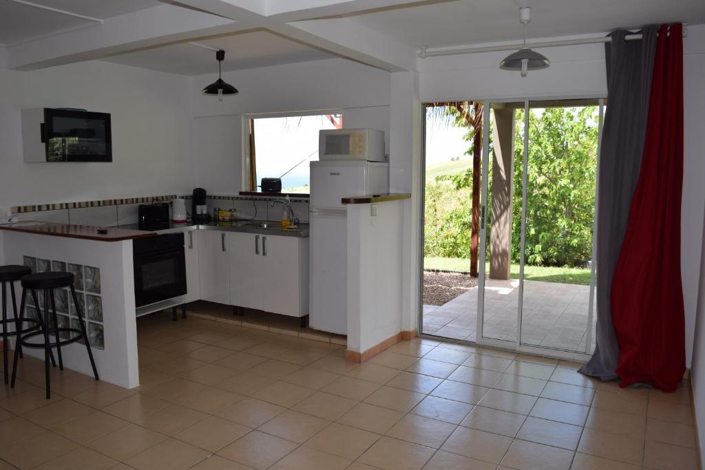 Kuchyň nebo kuchyňský kout v ubytování Appartement vue mer