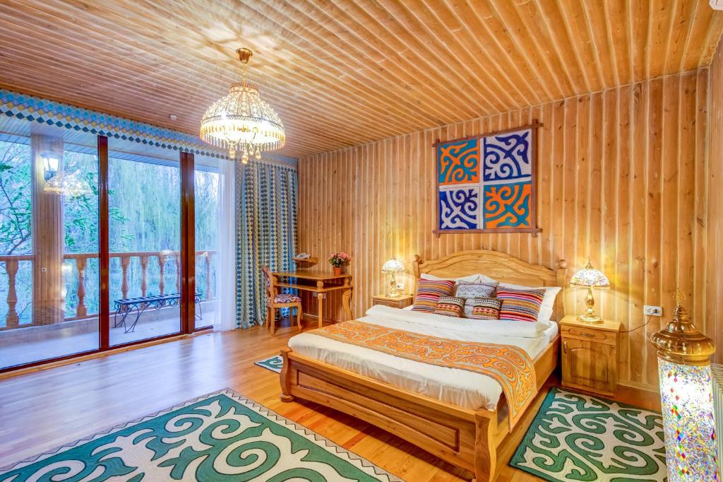 Postel nebo postele na pokoji v ubytování Navat Hotel