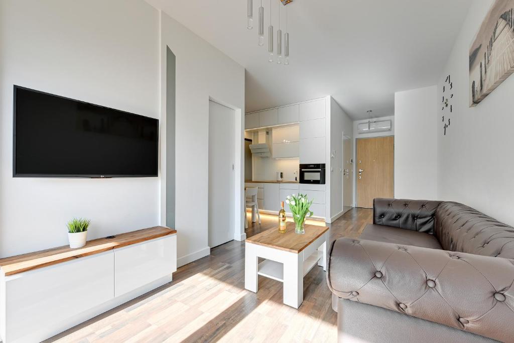 Televízia a/alebo spoločenská miestnosť v ubytovaní VISBY : Premium Apartments on the Beach