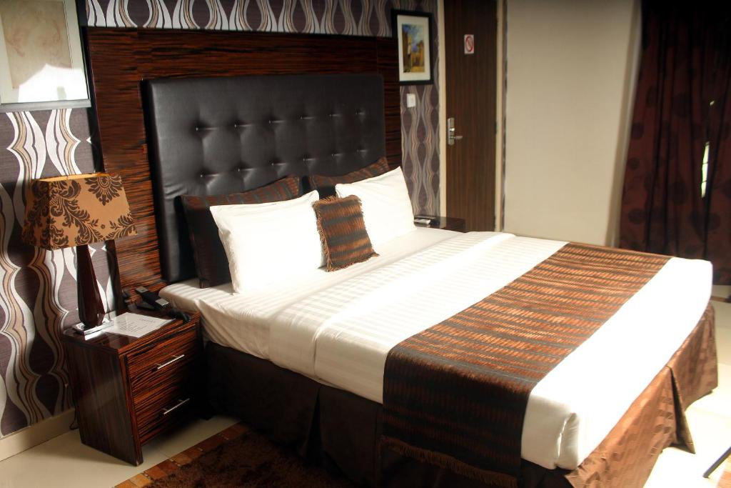 Postel nebo postele na pokoji v ubytování Villa Angelia Boutique Hotel
