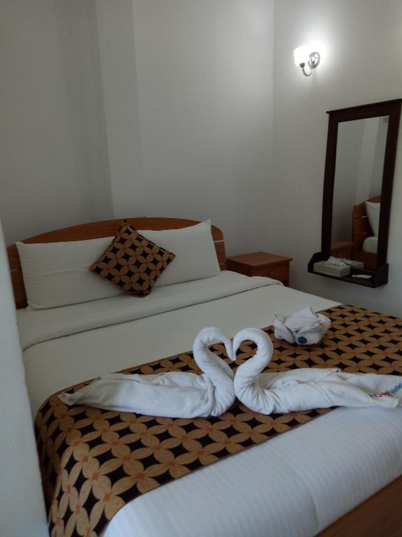 Postel nebo postele na pokoji v ubytování Otha Shy Airport Transit Hotel