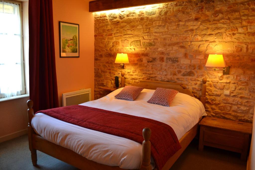 Ένα ή περισσότερα κρεβάτια σε δωμάτιο στο La Fleur de Lys