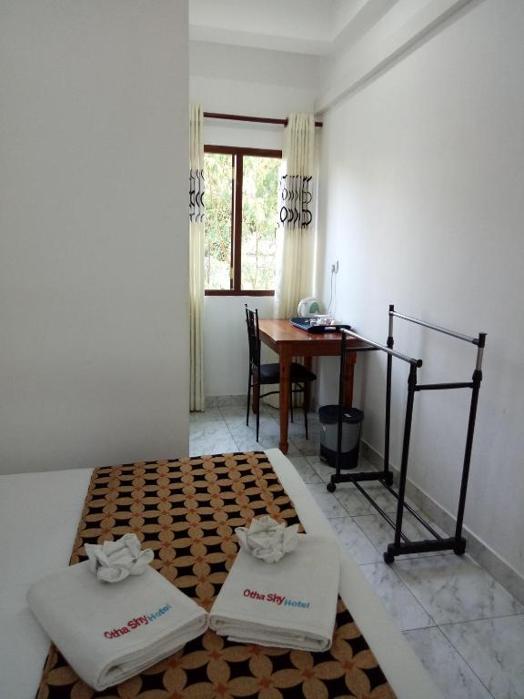 Postel nebo postele na pokoji v ubytování Otha Shy Airport Transit Hotel