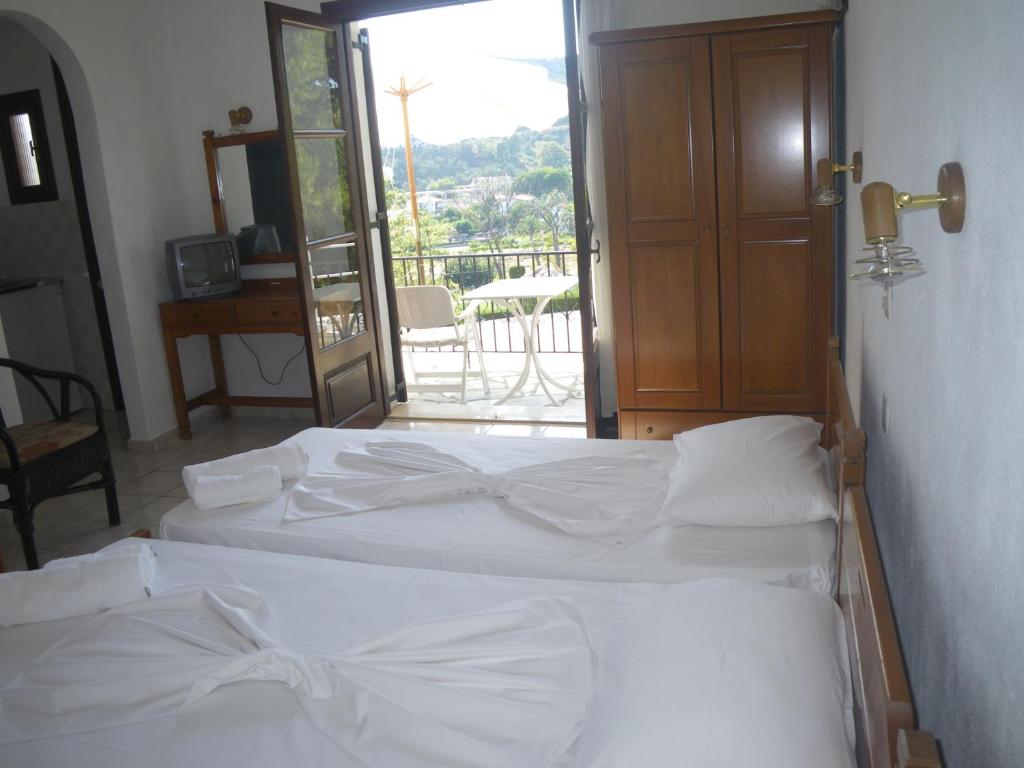 Un ou plusieurs lits dans un hébergement de l'établissement Villa Frideriki