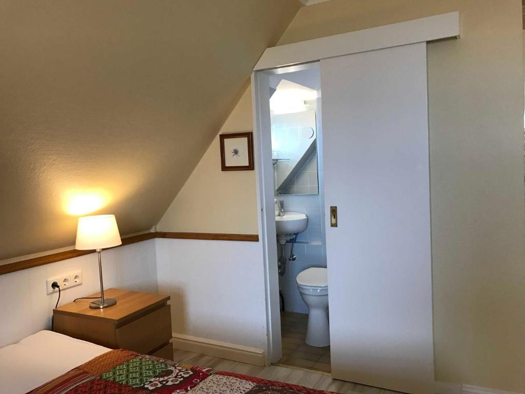 Postel nebo postele na pokoji v ubytování Gästehaus Friedeburg