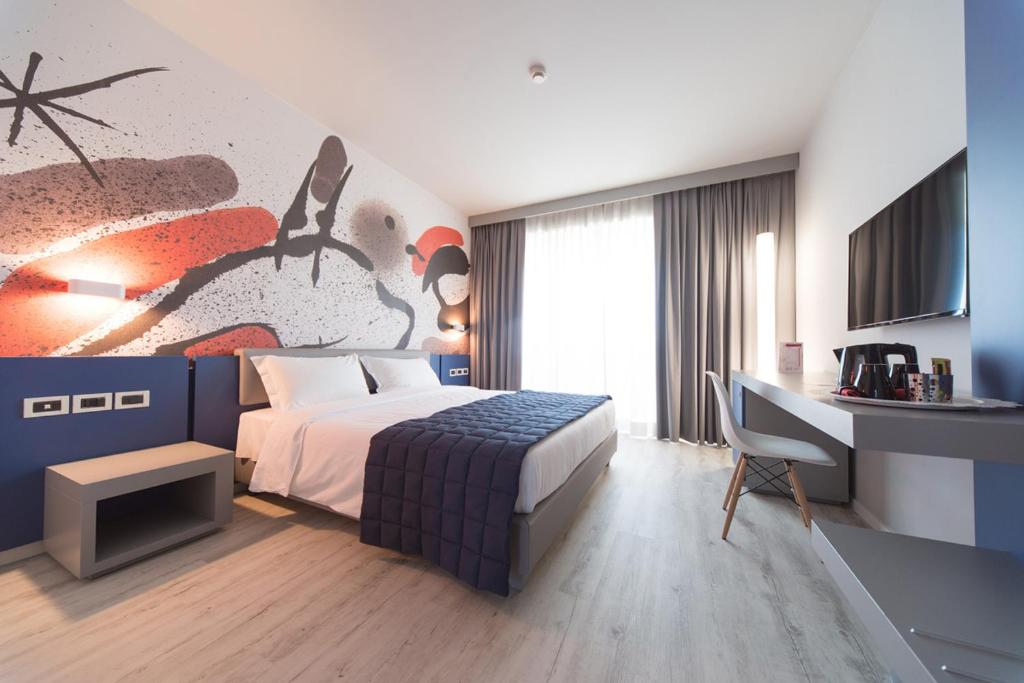 Postel nebo postele na pokoji v ubytování JR Hotels Gigli Firenze