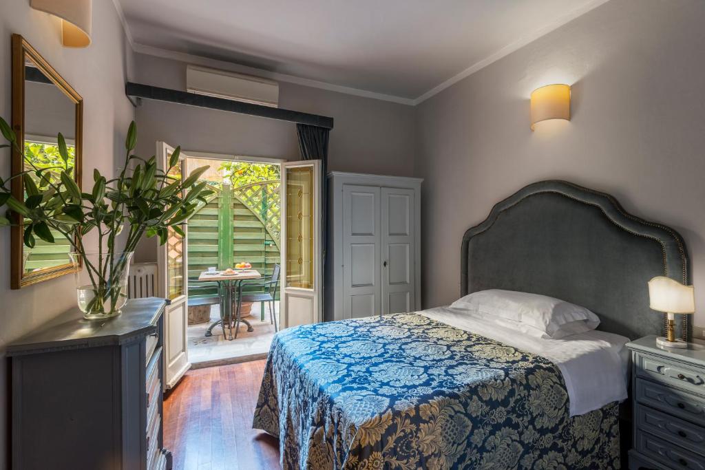 Postel nebo postele na pokoji v ubytování Hotel Palazzo dal Borgo
