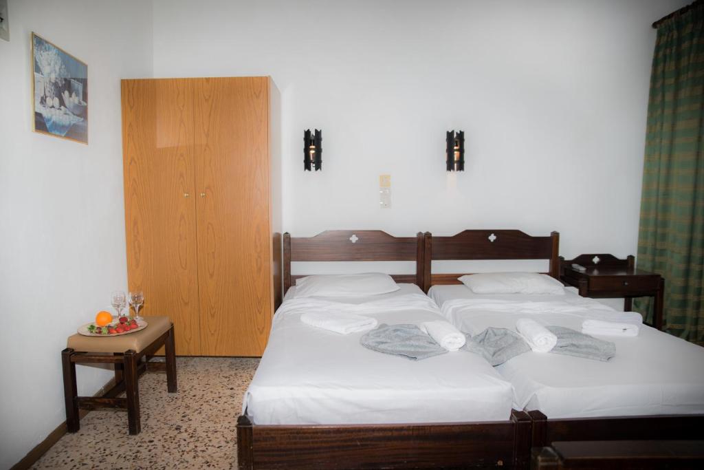 Postel nebo postele na pokoji v ubytování Harmony Hotel & Studio