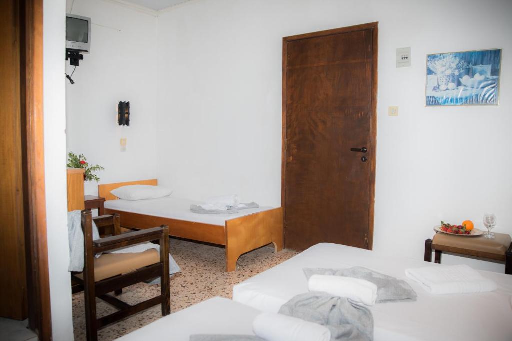 Postel nebo postele na pokoji v ubytování Harmony Hotel & Studio