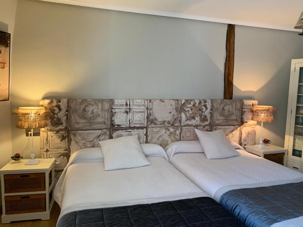 Posteľ alebo postele v izbe v ubytovaní Hostal El Resbalon