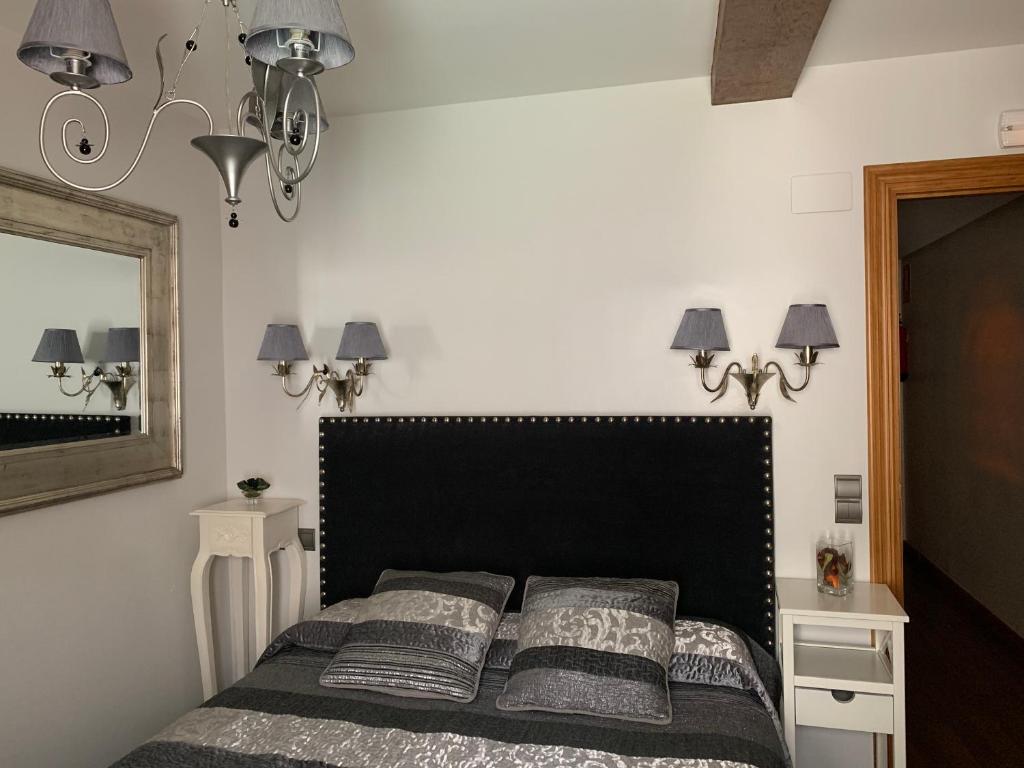 Posteľ alebo postele v izbe v ubytovaní Hostal El Resbalon