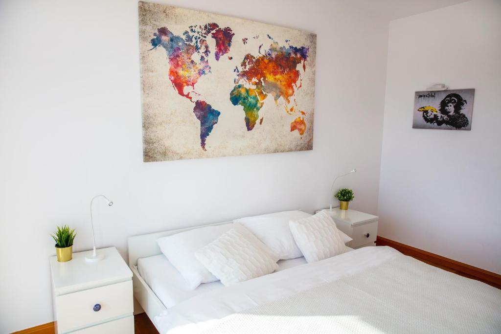 Postel nebo postele na pokoji v ubytování Apartamenty I.M.A Towarowa