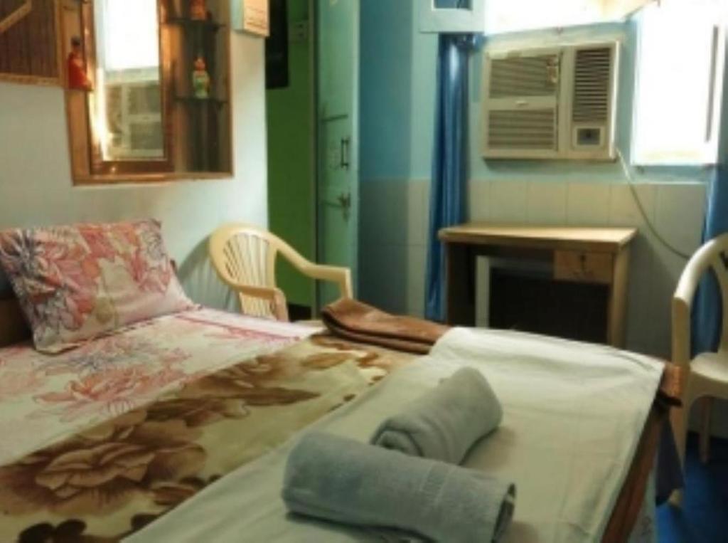 Postel nebo postele na pokoji v ubytování Mother Hostel