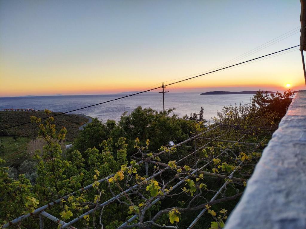 a view of the ocean at sunset from a ledge at Silver view in Batsi