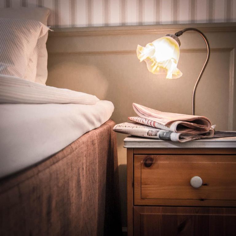 Postel nebo postele na pokoji v ubytování Waxholms Hotell
